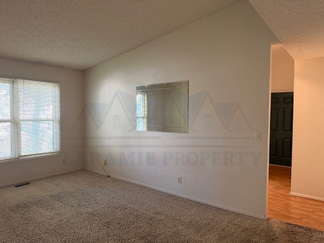 Building Photo - Single-Level 3-Bedroom Townhome with Primary Suite & Attached Garage