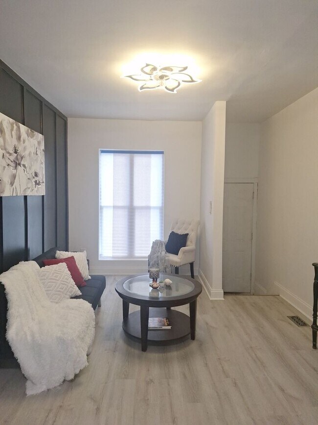 Building Photo - Historic Charm Meets Modern Comfort: 2BR Baltimore Townhouse with Private Yard