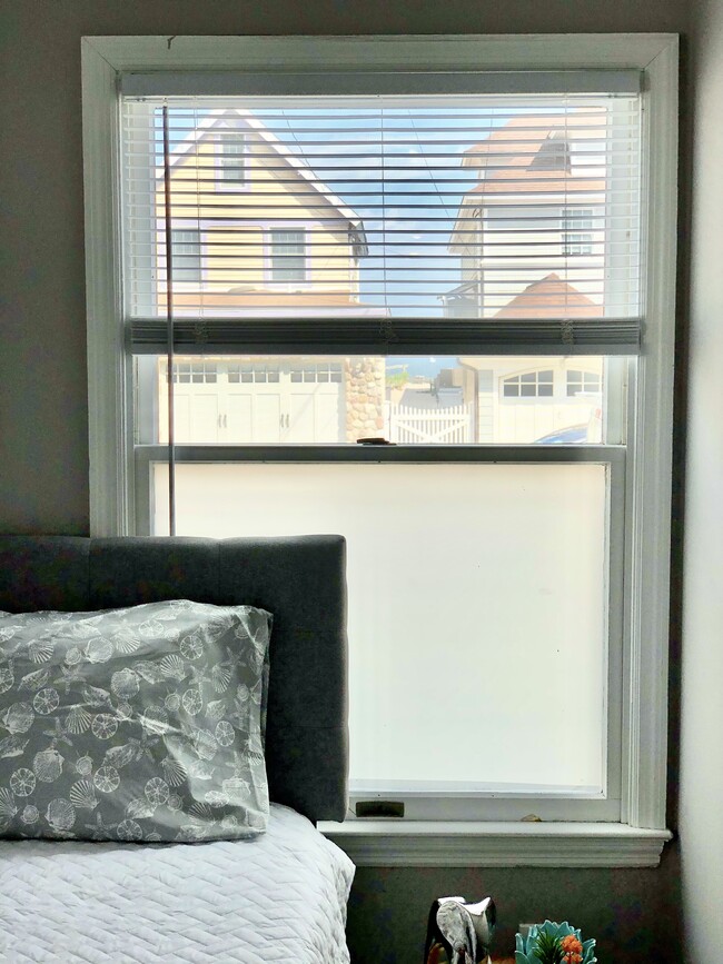 Bedroom 2 (Queen) - Beach views with closet and chair - 840 E Broadway