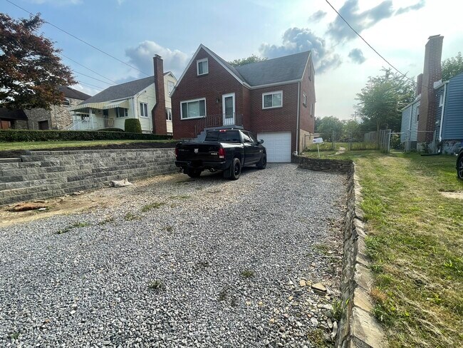 Driveway fits 4+ cars + garage. - 1630 Fiat St