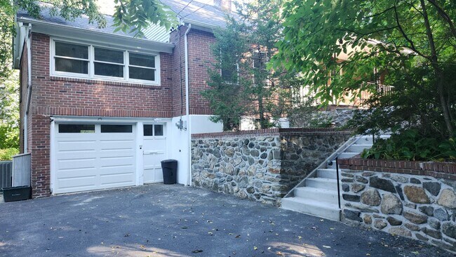 Building Photo - Elegant Multi-Level Brick Residence with Outdoor Oasis