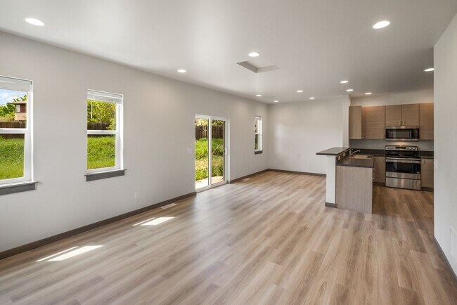 Building Photo - Pet Friendly! Gorgeous 3 Bedroom condo with double stall attached garages with AC.