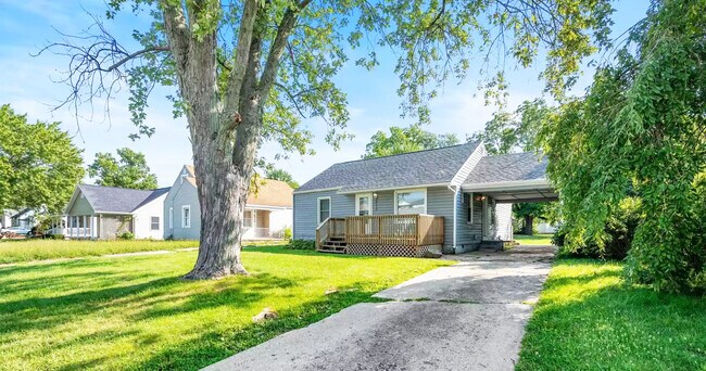 Covered car port for additional parking (garage and more off-street parking in back). - 2112 N Hollywood Ave