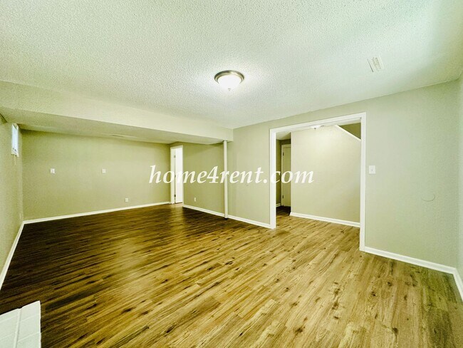 Building Photo - Updated Raytown Ranch w/ Wood Floors, SS Appliances, Finished Basement and a Fenced Yard!