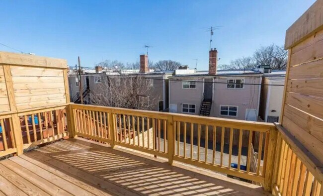 Building Photo - “Elegant 3-Story Home Showcasing High-End Renovation, Gourmet Kitchen, and Private Deck for Moder...