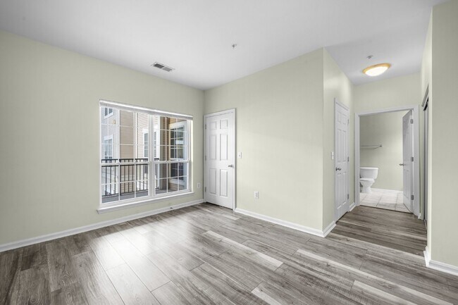 Building Photo - Two-bedroom, two-bathroom model with a den, located on the third floor.