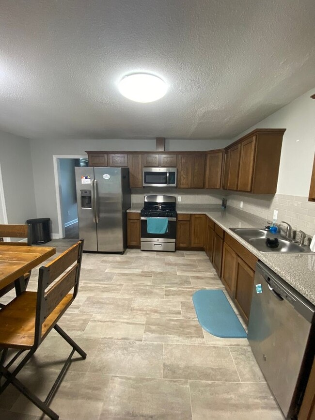 Building Photo - Spacious 3BR/2BA with Open Layout and Large Backyard