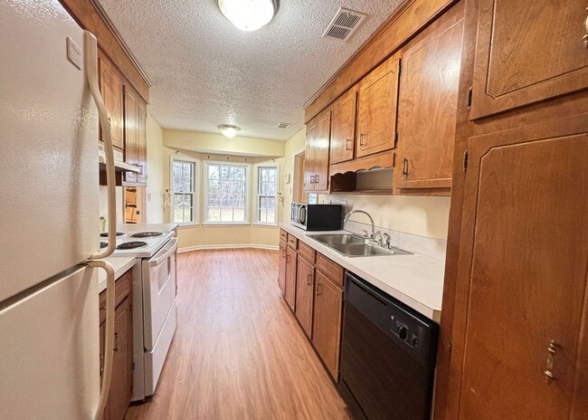 Building Photo - Available now. Freshly renovated! 4/3 Home...