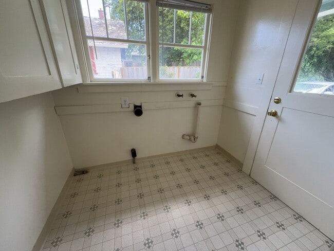 Building Photo - Sit out with your pet on the patio of this...
