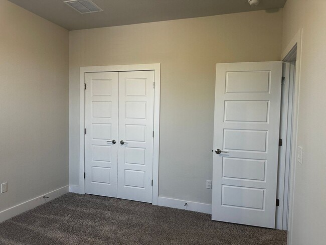 Building Photo - For Lease – Modern 2023 Condo Backing to Greenbelt | Creekside at Pioneer Crossing West