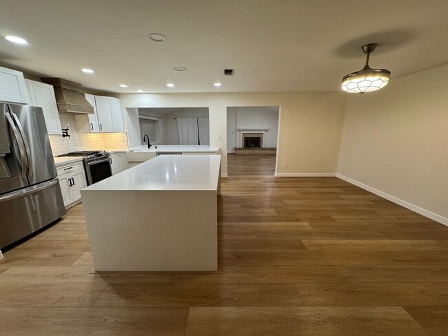 Building Photo - Beautifully Remodeled Home With Front & Si...