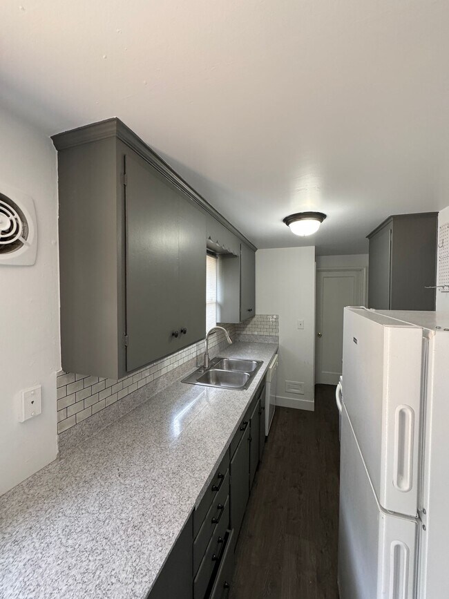 Building Photo - Spacious Two Story (2BR/1BA) Home with Large Fenced-In Yard