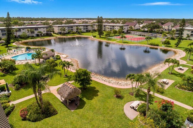Building Photo - AVAILABLE NOW! Furnished Ground-Floor End Unit | Lake & Pool Views | Minutes to Marco Island & Do...