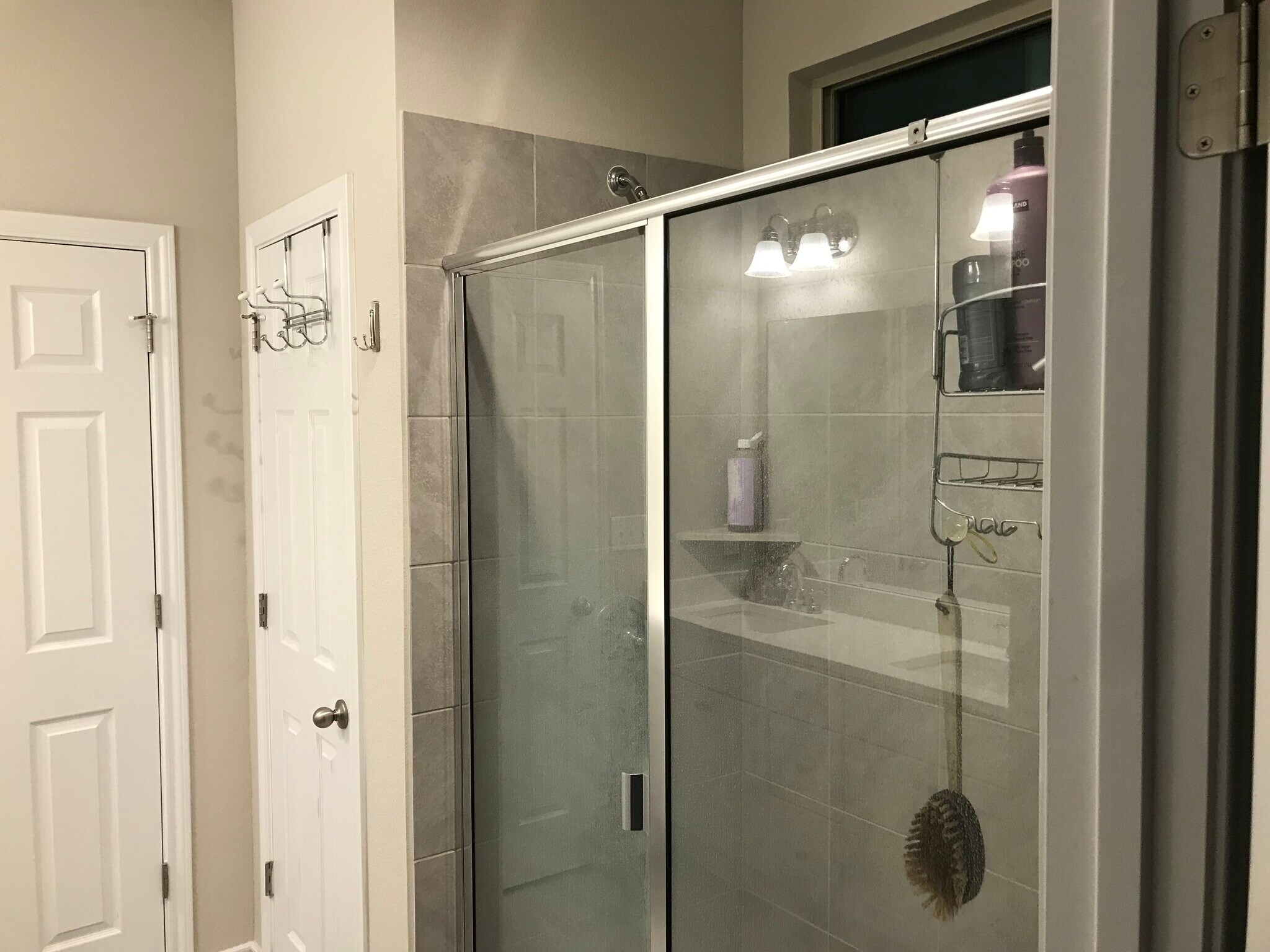 Master bathroom with walk in shower and linen closet. - 1313 Eagle Ridge Trl