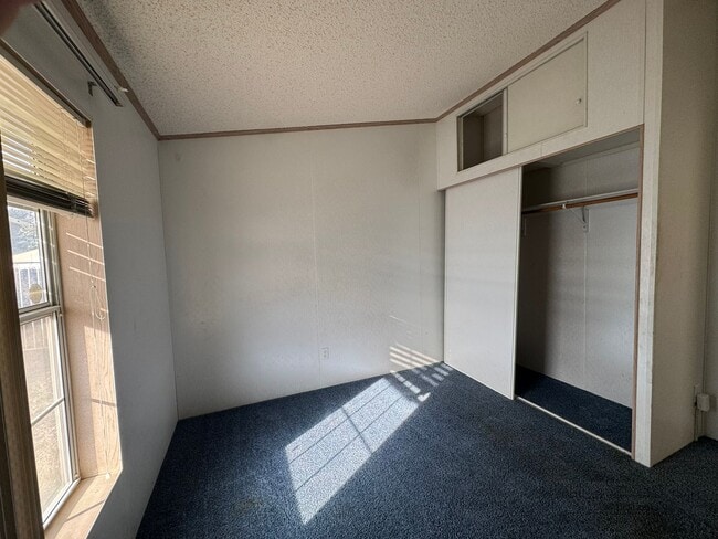 Building Photo - Sunrise Vista -2 Br, 2Ba home with covered carport, fenced yard, storage