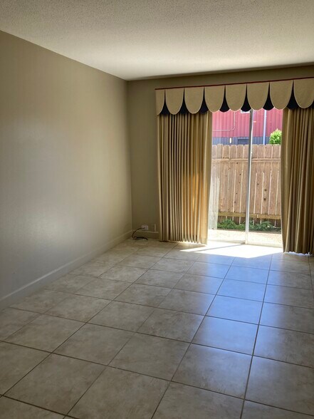 Spacious, sunny living room - 3320 N Arnoult Rd