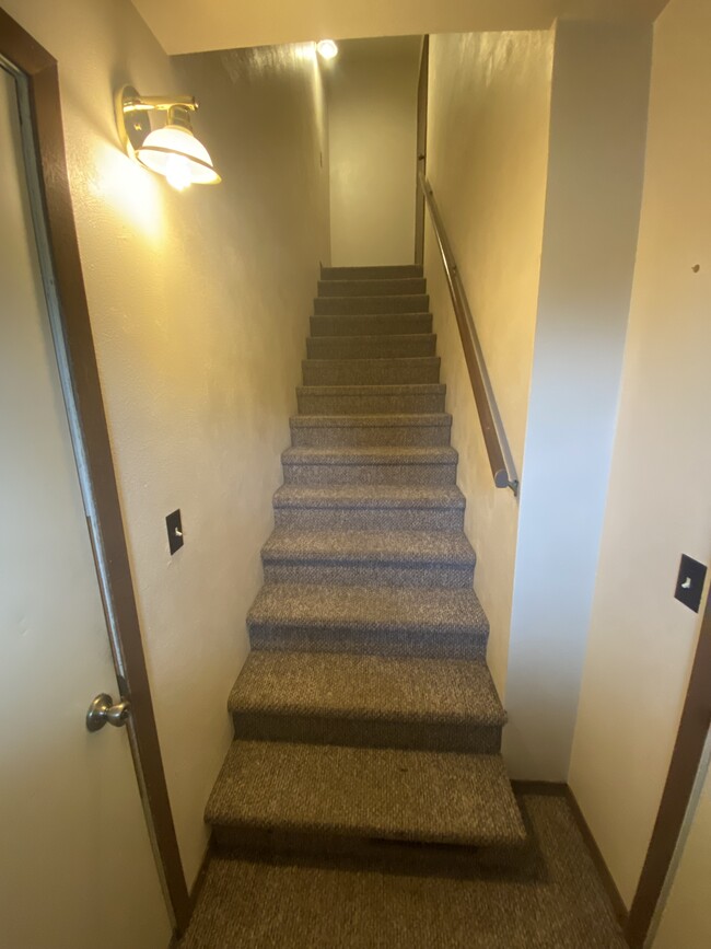 Stairs leading to unit, right door leads to shared front porch, left door leads to garage - 2912 12th St S