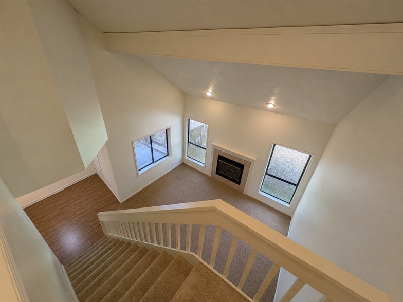 View of living room and dining room from upstairs - 6069 Fircrest St SE