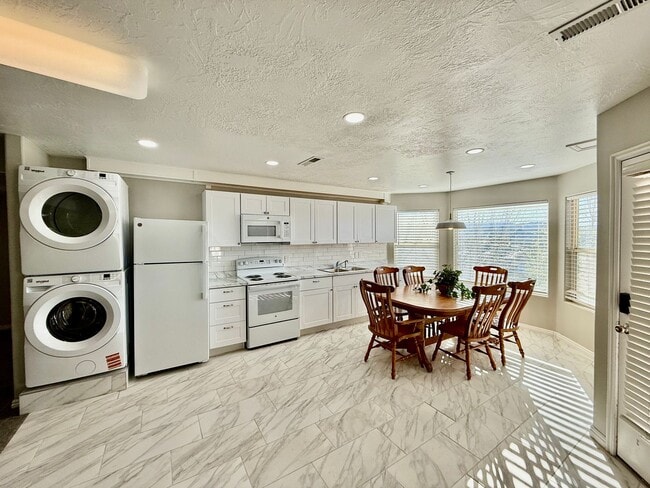 Building Photo - Furnished and Utilities Included: Two-Bedroom Basement Apartment with Private Yard