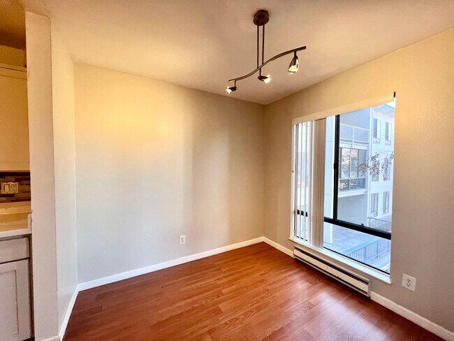 Building Photo - Spacious 1 bedroom with wood laminate floo...