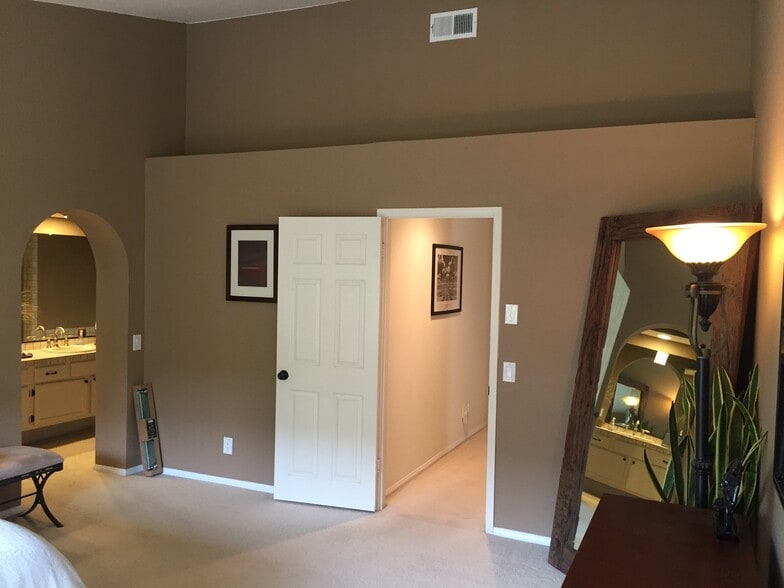 Master bedroom looking at hall entry. Master bathroom is off to the left in this view. - 2094 Balboa Cir