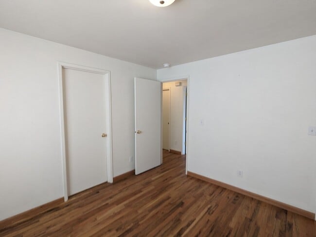 Building Photo - 2x2 duplex with a fenced yard, single-car ...