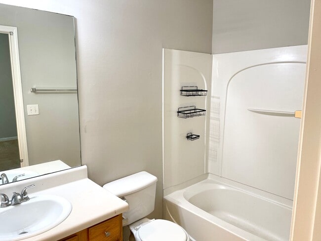 Building Photo - Welcome to this charming brick townhome in...