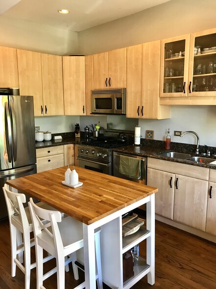 Kitchen with stainless appliances and granite countertops - 2327 N. Geneva Ter