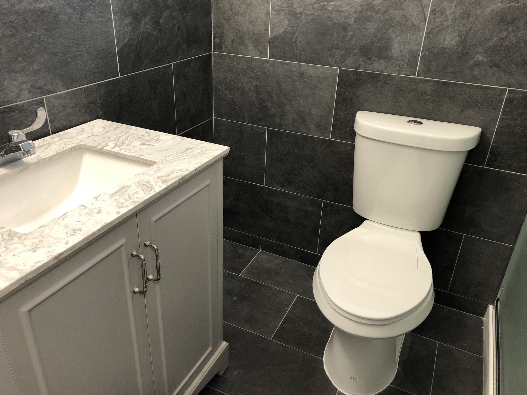 Bathroom walls and floors all tiled - 320 NW 34th Ave