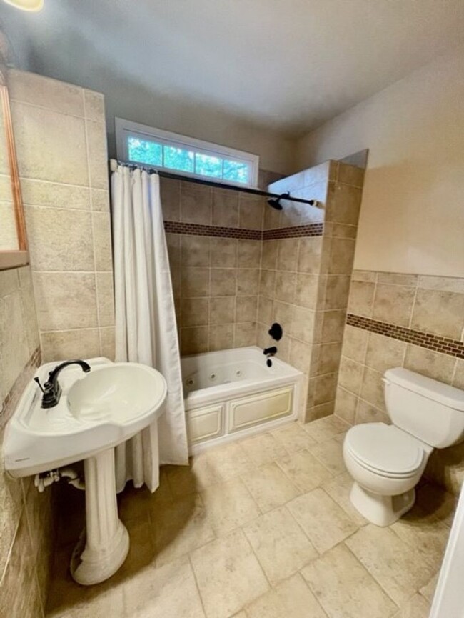 Building Photo - Introducing WesleyHeights401, a charming 3...