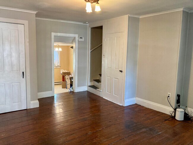 Living room looking into kitchen. - 92 Cottage St