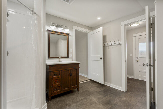 Master Bath (Where camera is sitting is additional room for wardrobes & closet racks) - 109 E Thompson Ave