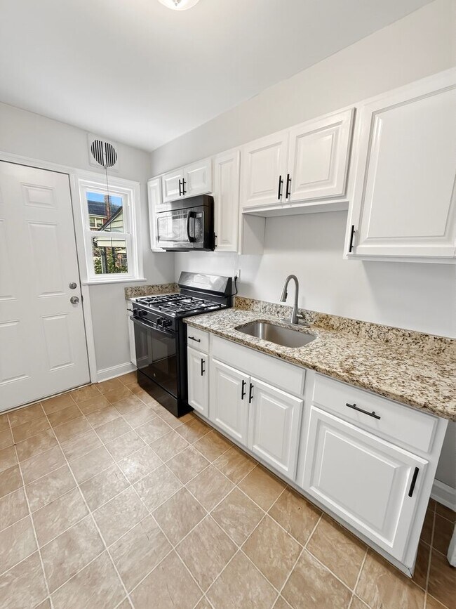 Building Photo - Spacious Dundalk Home with Finished Basement & Fireplace