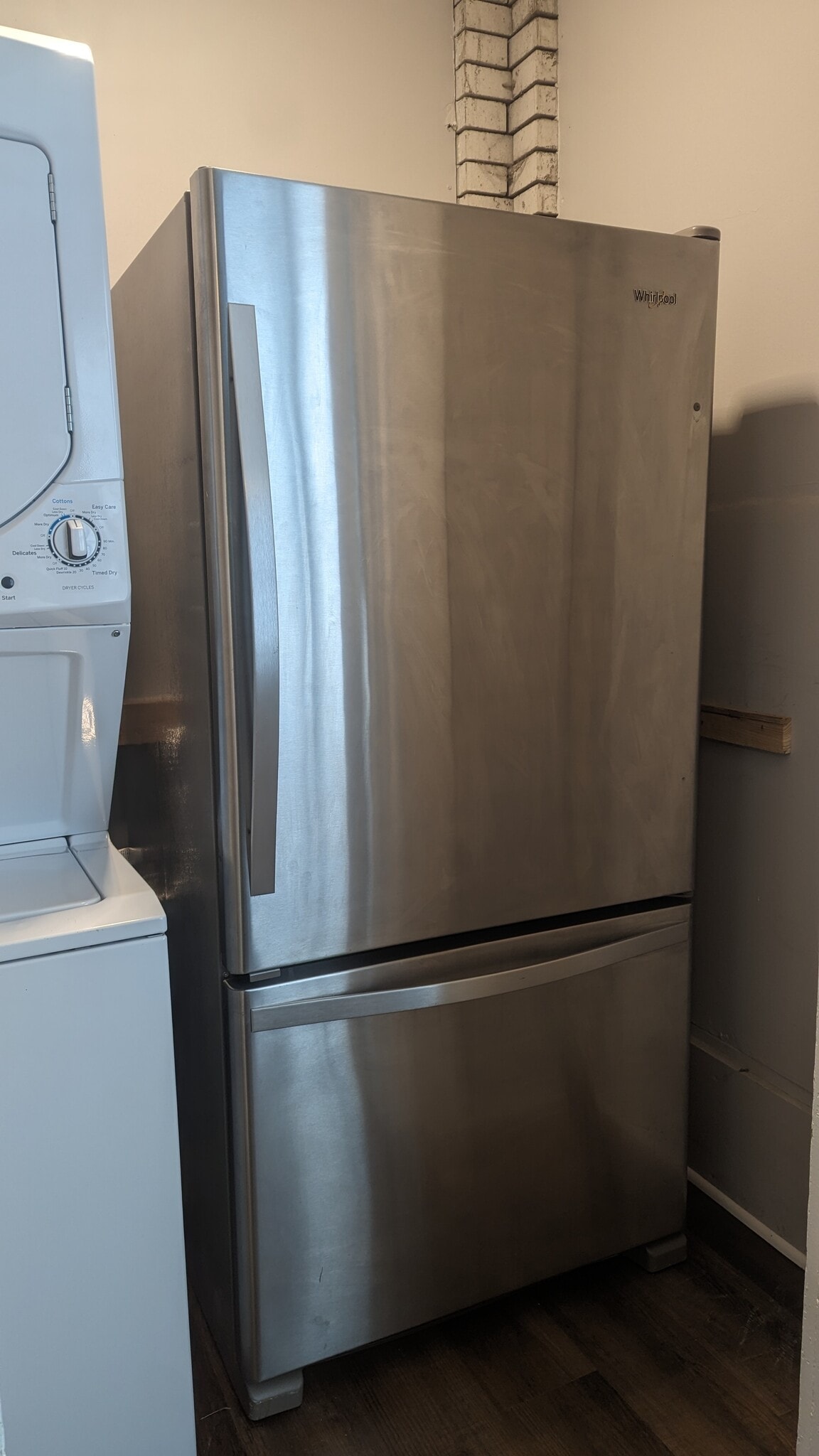 Laundry room & fridge adjacent to kitchen - 502 Woodruff Place Middle Dr