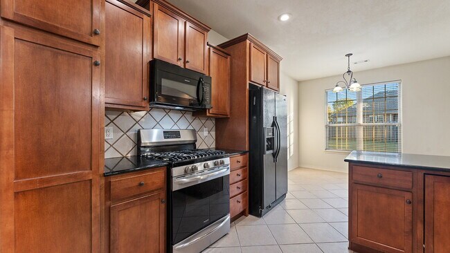 Building Photo - Charming 4-Bedroom Fayetteville Retreat with Granite Accents & Warm Fireplace!