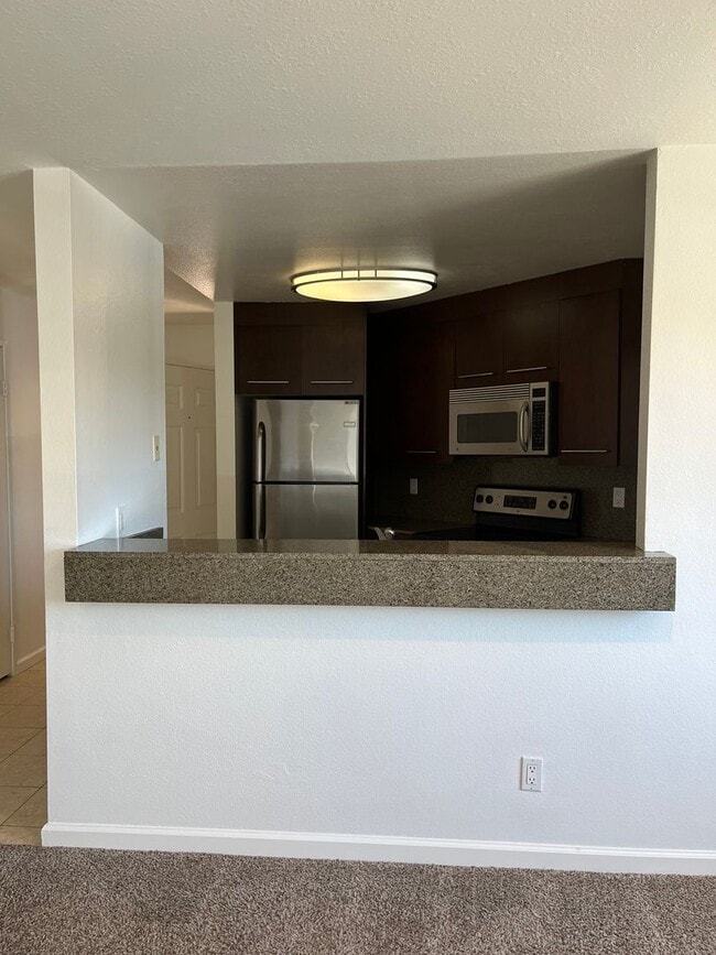 Building Photo - Upgraded upstairs corner unit in the Verano Complex