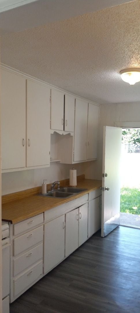 Building Photo - NEW listing-refinished hardwood floors, new laminate and paint throughout