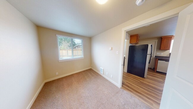 Building Photo - Charming 2 Bedroom Duplex - Granite Counters, Plank Flooring, Fully Fenced, Storage Shed!