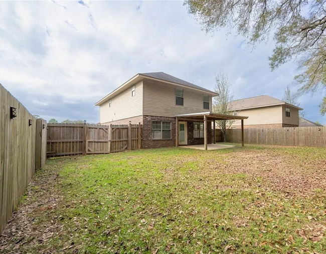 Our Home from the rear facing West. Large fenced-in back yard! Great for play and storage! - 12366 Copperwood Dr