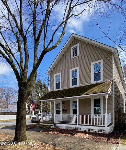 Front View - Front porch goes with this unit! Use the furniture on the porch, or use your own! - 104 Catherine St