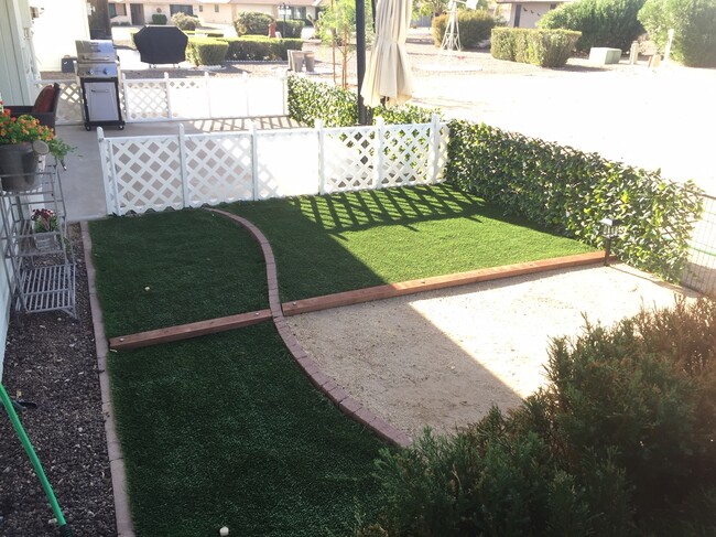 Attached pet pen area with feet pleasing, no maintenance artificial turf. - 12414 W Nugget Ct