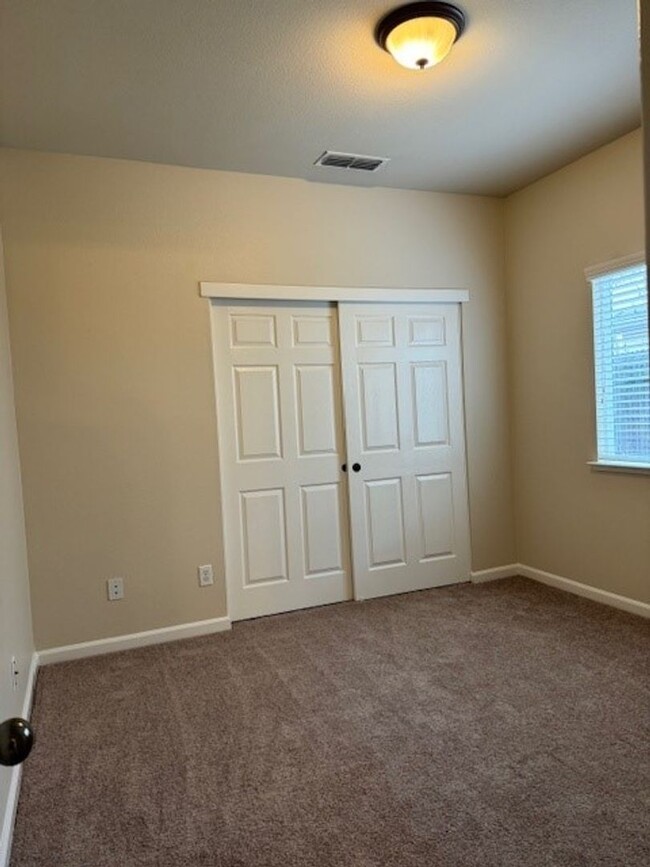 Building Photo - Gated Roseville Community with new paint a...