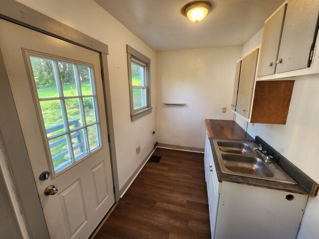 Building Photo - 4 BR home with first-floor living, new roof, and a private-feeling backyard in Lincoln Place