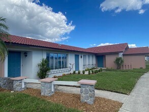 Building Photo - Updated 2-bedroom waterfront duplex with walk-in closets, enclosed Florida room, and canal views ...
