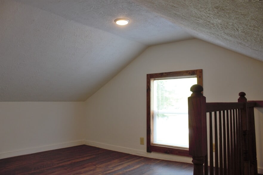 Upper bedroom, completely renovated, newer window, wiring, walls, flooring, lighting fixture, electrical. - 9331C Tallmadge Road