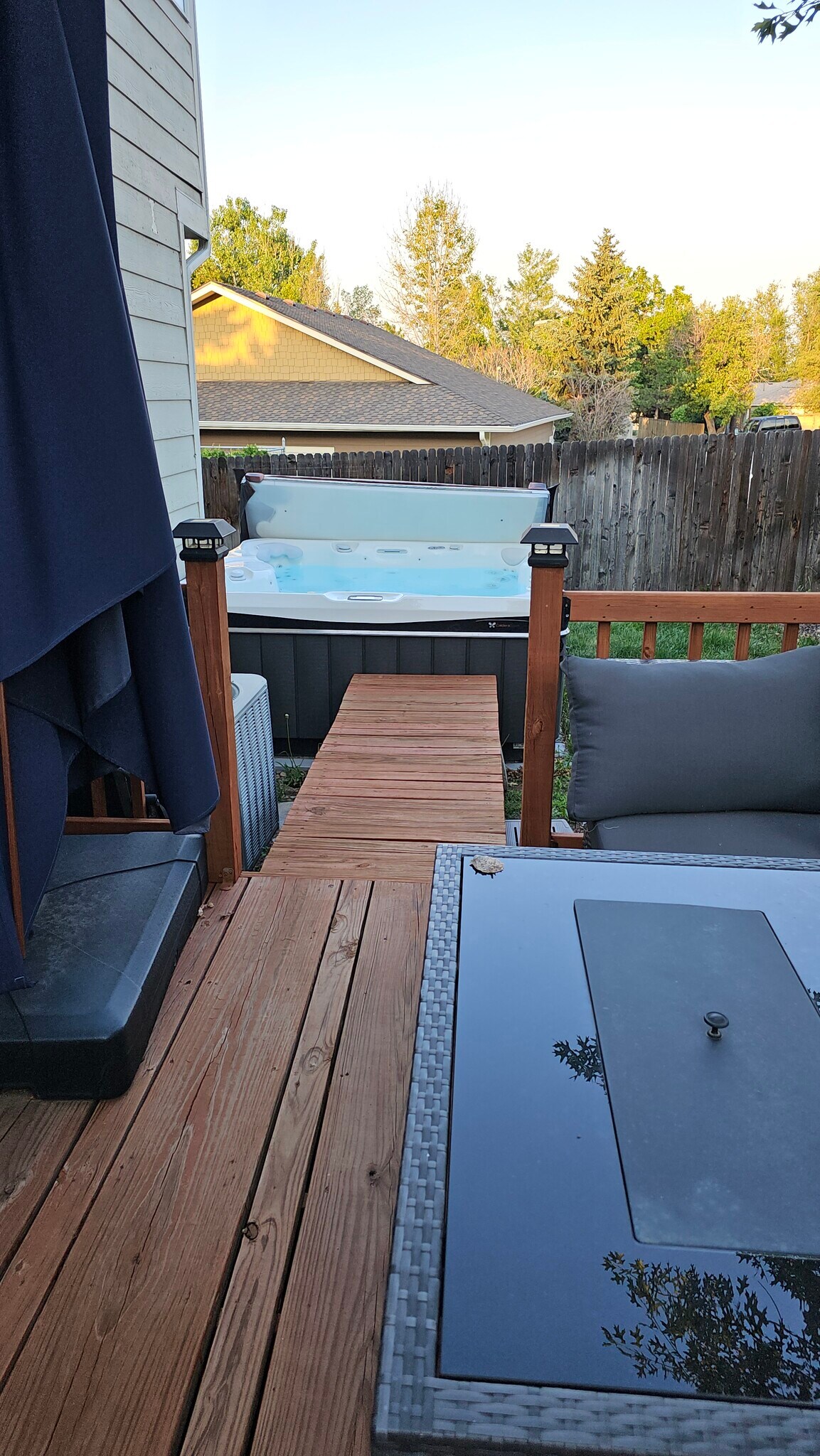 wood deck with propane firepit, outdoor seating, hot tub - 6782 Swadley Court