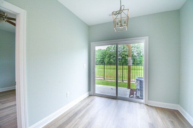 Building Photo - New END UNIT Townhome with Pond View and D...