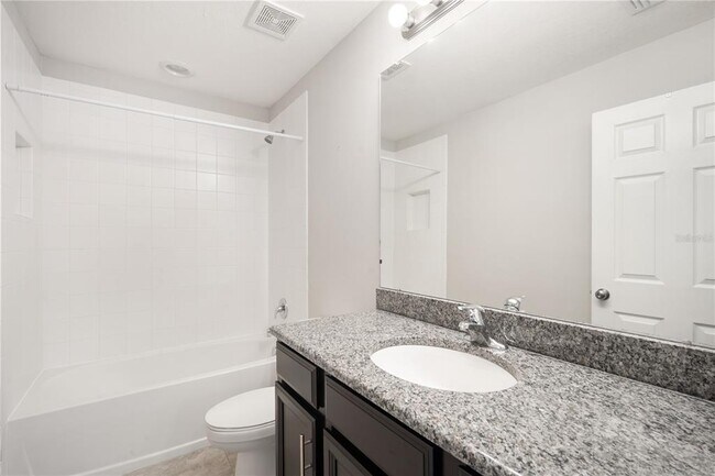 Building Photo - 7042 Summer Holly Pl