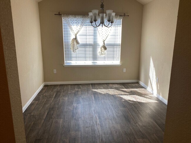 Building Photo - Three Bedroom, Two Bath, Two Car Garage, Washer and Dryer are included.