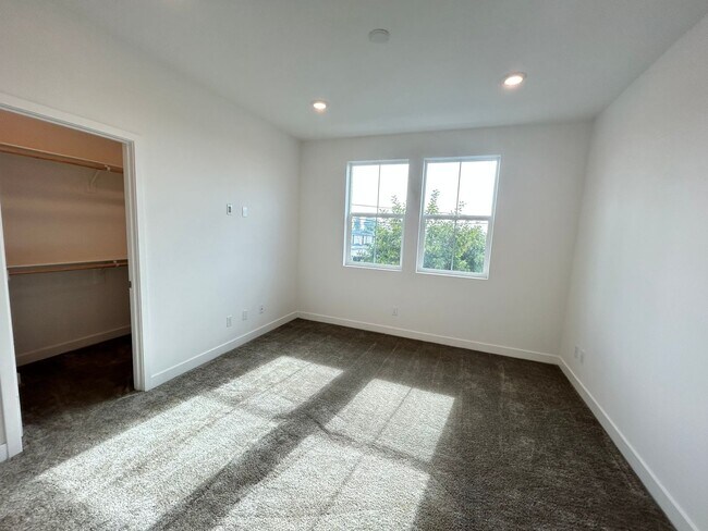 Building Photo - Gorgeous, 3 level townhome, featuring 2 car garage central Air, and in Unit laundry.